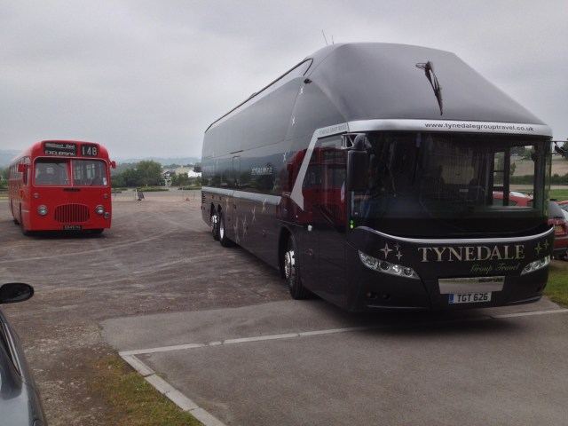 Our Midland Red bus no 5545 dwarfed by a modern cousin from Northumberland (in the car park at Cheltenham)