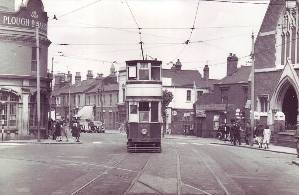 Tram on the Bristol Road in Selly Oak in 1952. the Plough & Harrow is on the left.